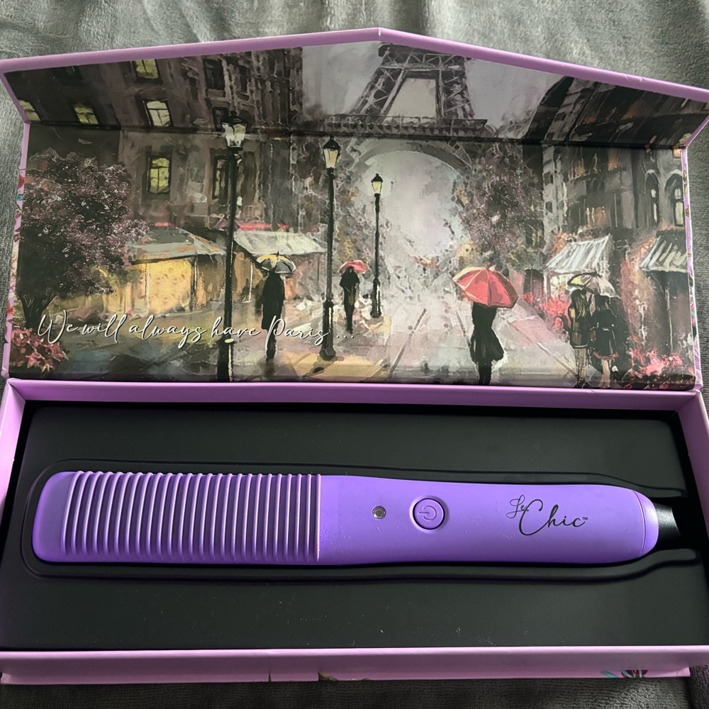 Never used Curling iron,flat iron, hairbrush, all in one.